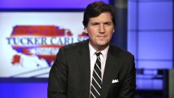 In this March 2, 2017, file photo, Tucker Carlson, host of "Tucker Carlson Tonight," poses for photos in a Fox News Channel studio in New York.