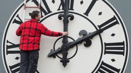 Picture taken on March 23, 2018 shows a technician working on the clock of the Lukaskirche Church in Dresden, eastern Germany. - The European Commission will recommend EU member states abolish daylight saving, where clocks are advanced by one hour in summer, its president Jean-Claude Juncker said on German television on August 31, 2018. (Photo by Sebastian Kahnert / dpa / AFP) / Germany OUT        (Photo credit should read SEBASTIAN KAHNERT/AFP/Getty Images)