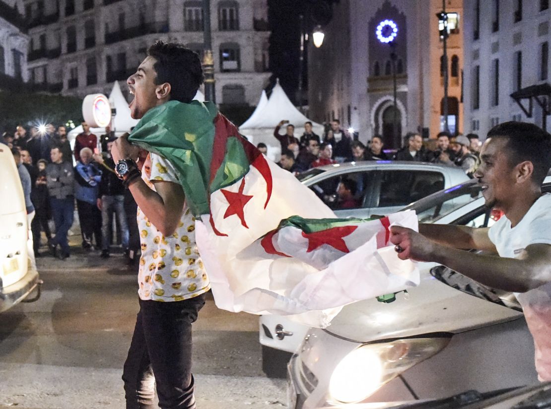 Algerians celebrate on the streets after Bouteflika announced he would not stand for a fifth term.