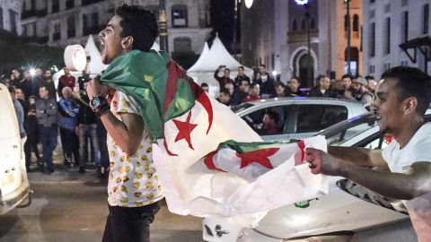 Algerians celebrate on the streets after Bouteflika announced he would not stand for a fifth term.