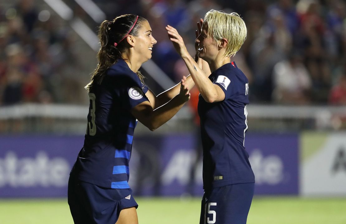 Alex Morgan #13 and Megan Rapinoe #15 of USA celebrate after a goal against Mexico in October 2018.