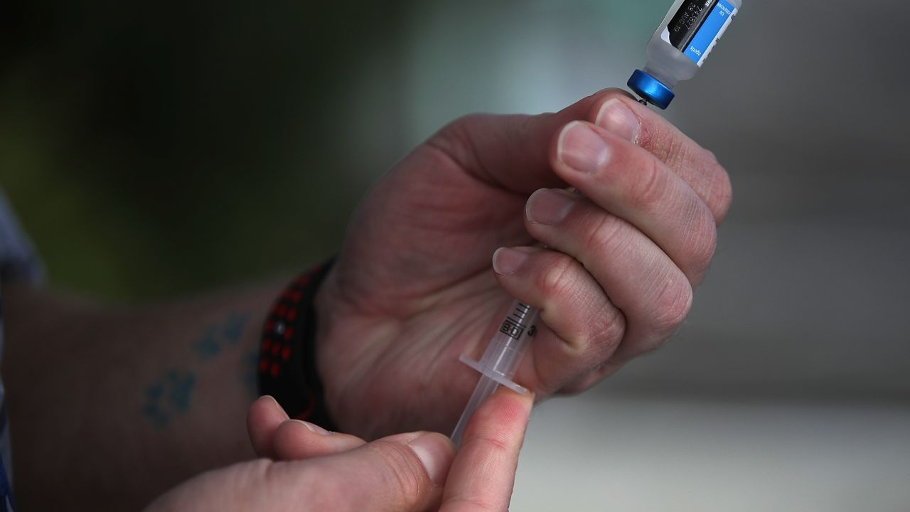 LOS GATOS, CA - JANUARY 25: Veterinarian technician Justin Jones prepares a syringe with a canine influenza vaccine at Los Gatos Dog and Cat Hospital on January 25, 2018 in Los Gatos, California. Veternarians have seen a surge in dog owners seeking to have their dogs immunized for "dog flu" after reports that the highly contagious canine influenzaÑH3N2 and H3N8Ñis rapidly spreading. (Photo by Justin Sullivan/Getty Images)