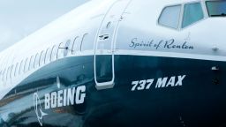 FILE - In this Tuesday, Dec. 8, 2015, file photo, the first Boeing 737 MAX airplane to roll off Boeing's assembly line in Renton, Wash. is shown parked before an employee-only rollout event. The Dow Jones industrial average climbed to the 20,000-point mark from 19,000 largely because of three stocks: financial firm Goldman Sachs, aerospace giant Boeing, and technology and consulting company IBM. Put together, those three companies are responsible for almost half the gain that brought the blue chip index to its latest millennial mark on Wednesday, Jan. 25, 2017. (AP Photo/Ted S. Warren, File)