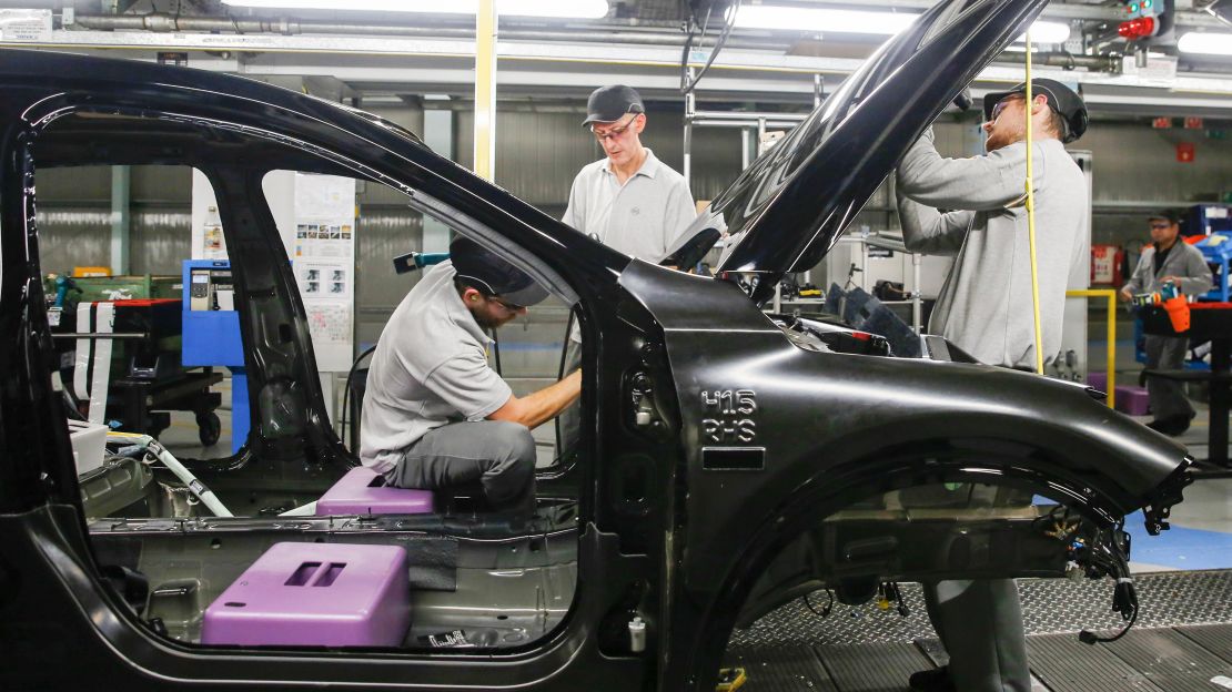 Workers prepare an Infiniti Q30 in Sunderland.