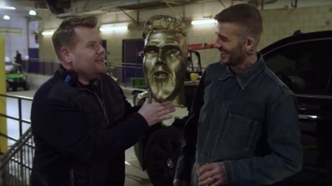James Corden, left, and David Beckham with part of the fake Beckham statue.