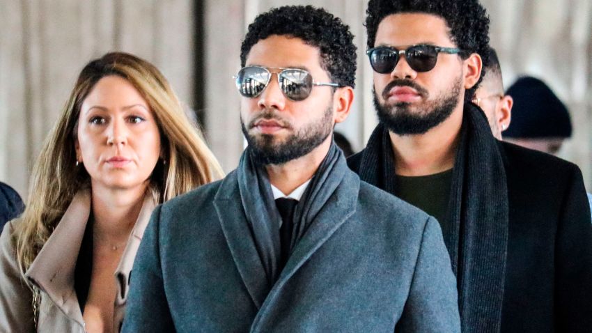 Actor Jussie Smollett(C) and team arrive for a court hearing at the Leighton Criminal Courthouse on March 12, 2019 in Chicago. - A Chicago grand jury on March 8, 2019 indicted American actor Jussie Smollett on 16 felony counts after allegedly lying to police about being the victim of a racist, homophobic hate crime. Police say Smollett -- who gained fame on Fox musical drama "Empire" -- staged the attack in a bid to gain publicity and a bigger paycheck. (Photo by DEREK HENKLE / AFP)        (Photo credit should read DEREK HENKLE/AFP/Getty Images)