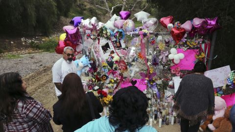 People gathered at a large memorial honoring the 9-year-old girl on Monday.