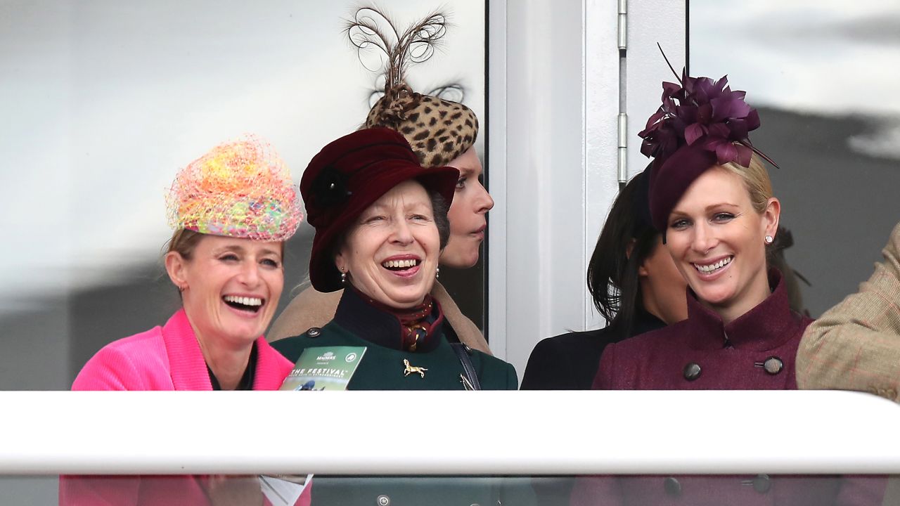 The Princess Royal (center) and Zara Tindall (right) watch the action during Ladies Day of the 2019 Cheltenham Festival.