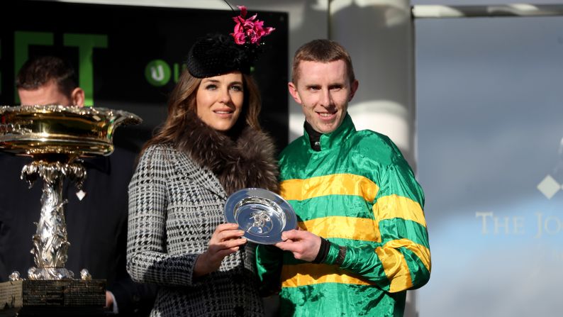 Actress and model Liz Hurley presented Walsh with the winning trophy by  at Cheltenham.