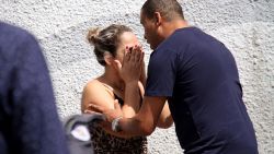 A man comforts a woman at the Raul Brasil State School in Suzano, Brazil, Wednesday, March 13, 2019. The state government of Sao Paulo said two teenagers, armed with guns and wearing hoods, entered the school and began shooting at students. They then killed themselves, according to the statement. (Mauricio Sumiya/Futura Press via AP)
