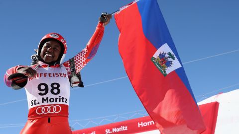 Marti waves her national flag at the finish area in St Moritz.