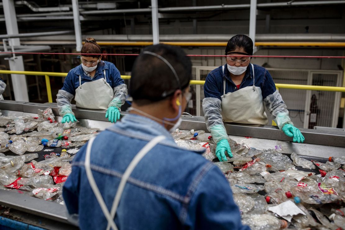 Workers sort plastic waste at a plastic recycling plant in Mexico.