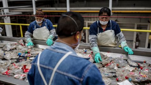 Workers sort plastic waste at a plastic recycling plant in Mexico.