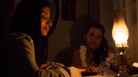 Venezuelan Yadira Delgado and her daughter Vanesa remain at their home in Caracas on March 9, 2019, during a massive power outage.  