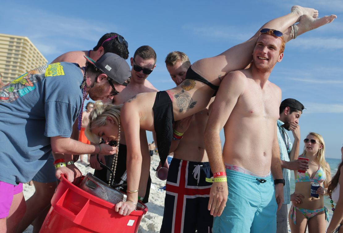 A woman drinks from a keg during spring break in March 2015 in Panama City Beach, Florida.