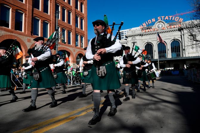 <strong>Denver:</strong> The Michael Collins Pipe & Drums band heads up 17th Avenue at the start of the 2018 parade.
