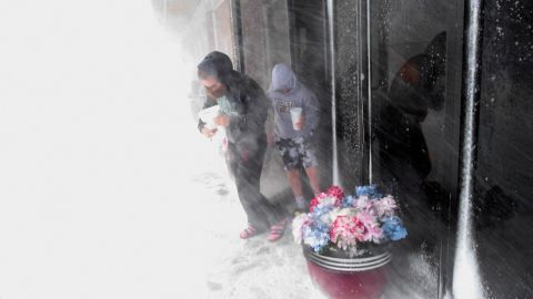 Children from Wichita, Kansas, head  to their hotel room for the night on March 13 after the storm stranded the family in Limon, Colorado.