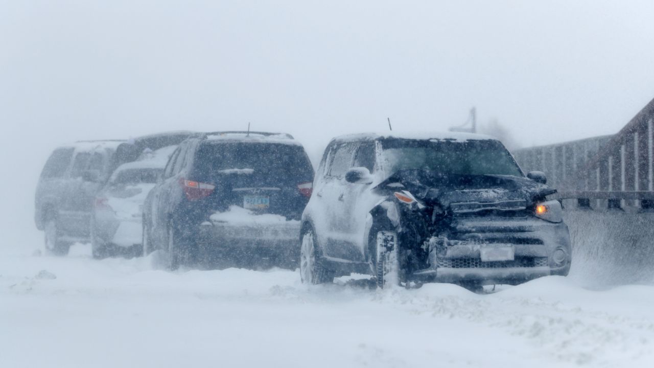 A string of wrecked vehicles sit on an overpass Wednesday over Interstate 70 in Aurora, Colorado.