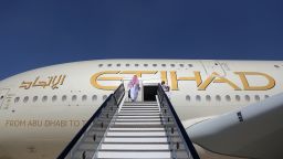 FILE: An attendee enters an Airbus SE A380 passenger aircraft, operated by Etihad Airways PJSC, during the 15th Dubai Air Show at Dubai World Central (DWC) in Dubai, United Arab Emirates, on Monday, Nov. 13, 2017. Airbus SE decided to stop making the A380 double-decker after a dozen years in service, burying a prestige project that won the hearts of passengers and politicians but never the broad support of airlines that instead preferred smaller, more fuel-efficient aircraft. Production of the jumbo jet will end by 2021, after the A380s biggest customer, Emirates, and a handful of remaining buyers receive their last orders. Photographer: Natalie Naccache/Bloomberg via Getty Images
