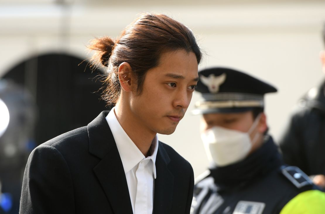 K-pop star Jung Joon-young arrives for questioning at the Seoul Metropolitan Police Agency in Seoul on March 14, 2019.