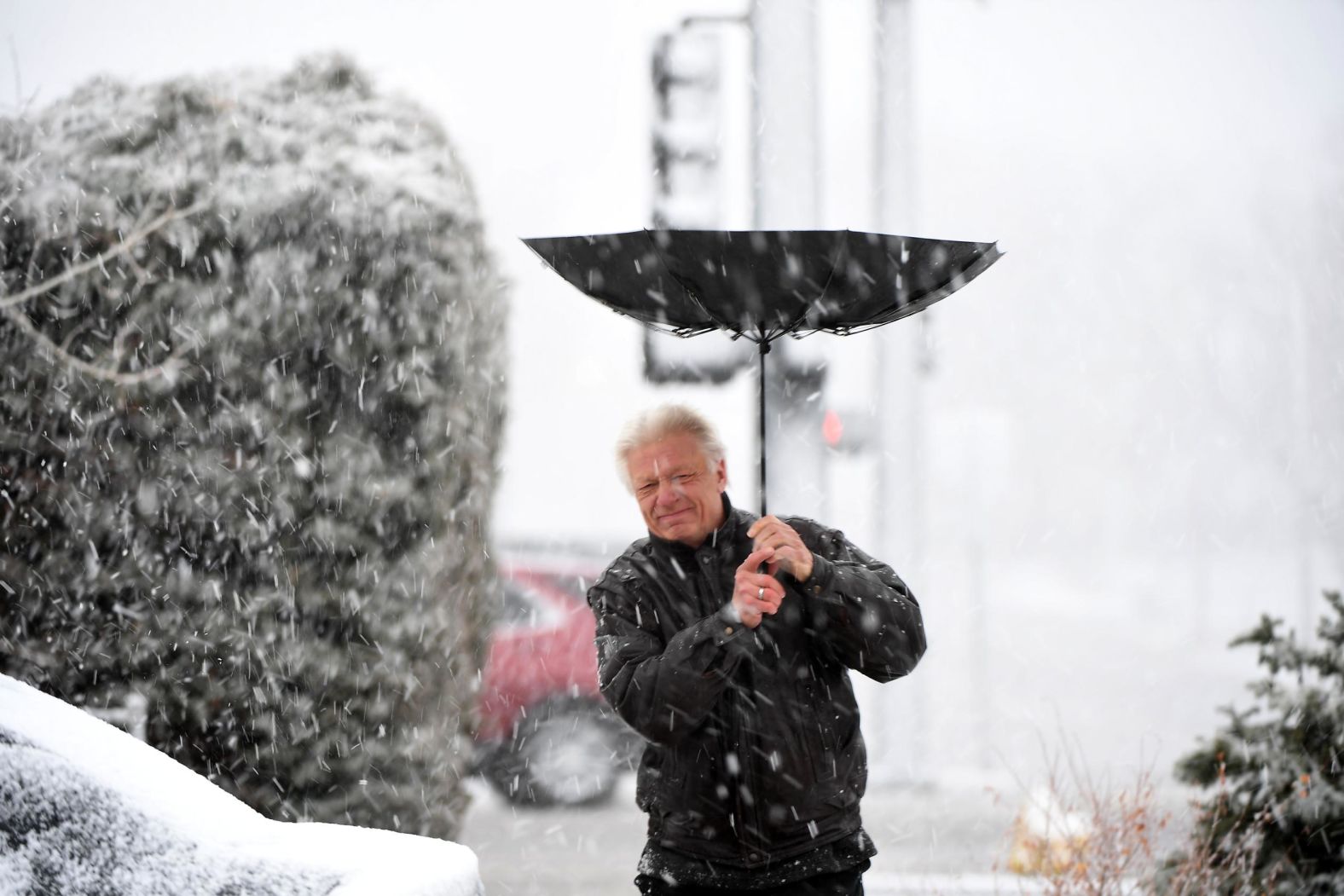 Ken Saari gets caught in a squall  in Edgewater, Colorado, on March 13 as the storm sweeps through the Denver area.