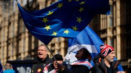 Anti-Brexit remain in the European Union supporters shout slogans during a protest outside the Houses of Parliament in London, Thursday, March 14, 2019. British lawmakers faced another tumultuous day Thursday, as Parliament prepared to vote on whether to request a delay to the country's scheduled departure from the European Union and Prime Minister Theresa May struggled to shore up her shattered authority. (AP Photo/Matt Dunham)