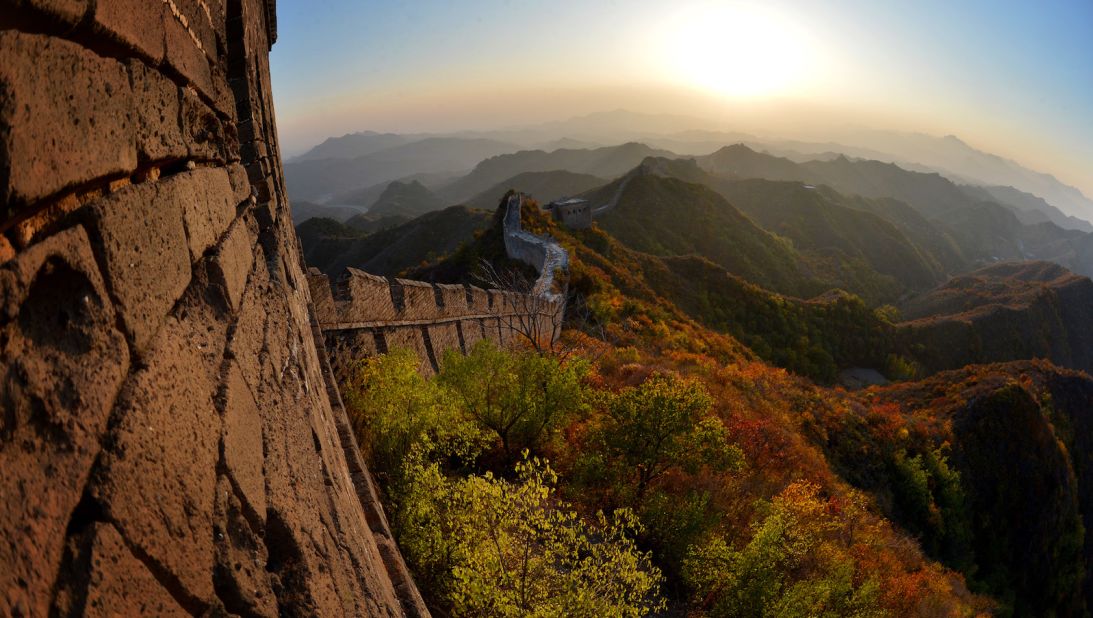 <strong>Great Wall of China: </strong>A remarkable feat of engineering, the Great Wall stretches anywhere from 1,500 to 13,000 miles (estimates vary) across northwestern China. This photo shows the sun setting over a section of the Great Wall at Jinshanling, in Hebei province. 