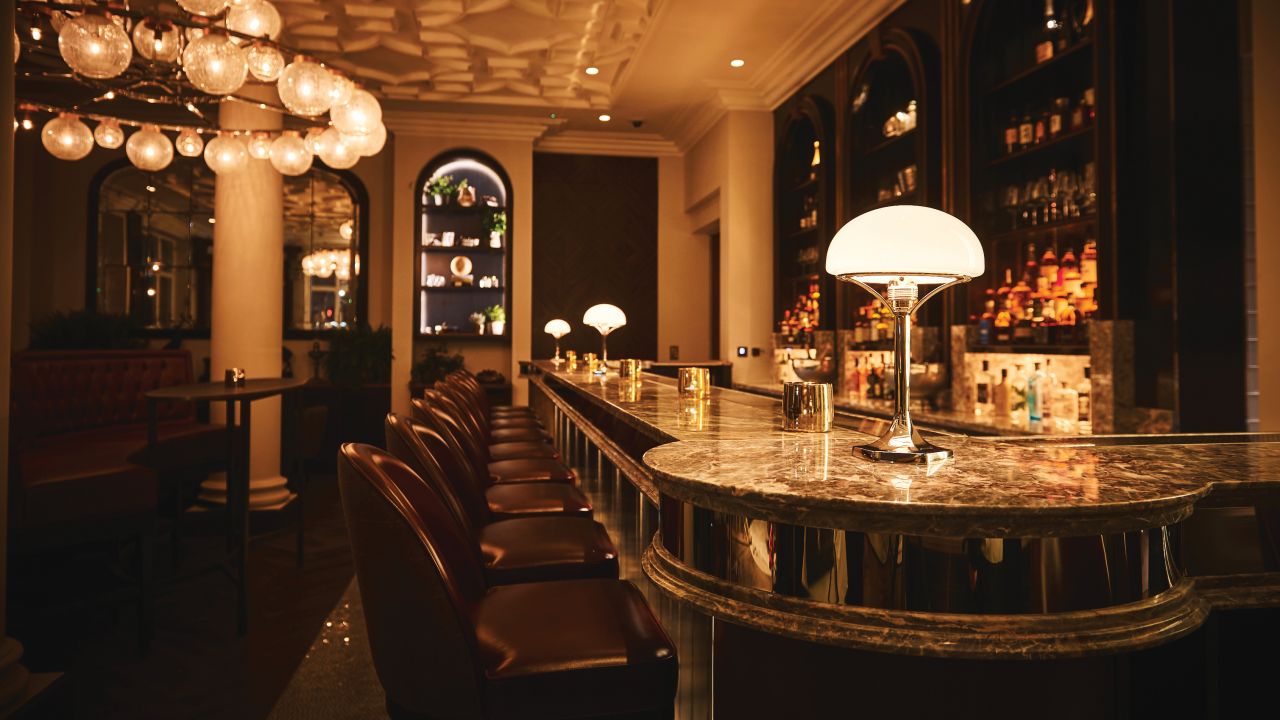 The inviting bar resembles a posh early 20th century English watering hole.