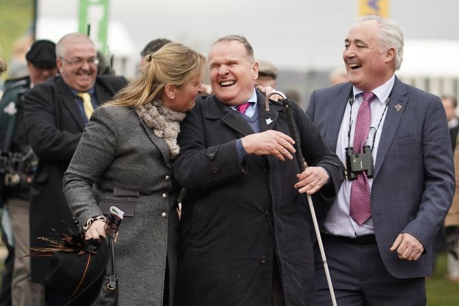 Owner Andrew Gemmell, who was born blind, celebrates with trainer Emma Lavelle (left) as his horse Paisley Park wins the feature Stayers Hurdle on St Patrick's Thursday at Cheltenham.