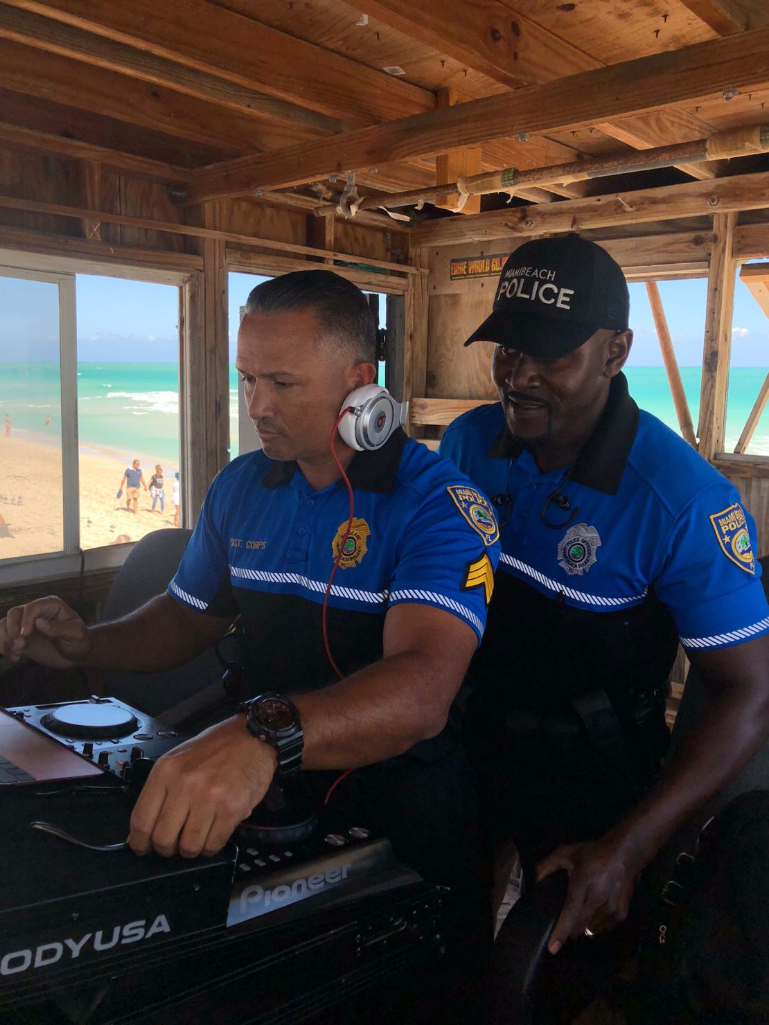 Miami Beach police DJing in a lifeguard booth on Miami Beach in March 2018. 