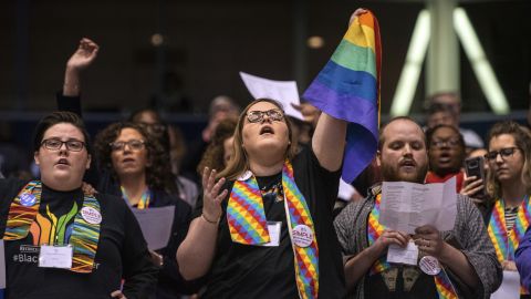 Protesters share their view during the United Methodist Church's special session of the General Conference in St. Louis in February.