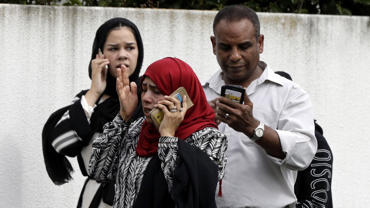 People talk on their phones after the attacks.
