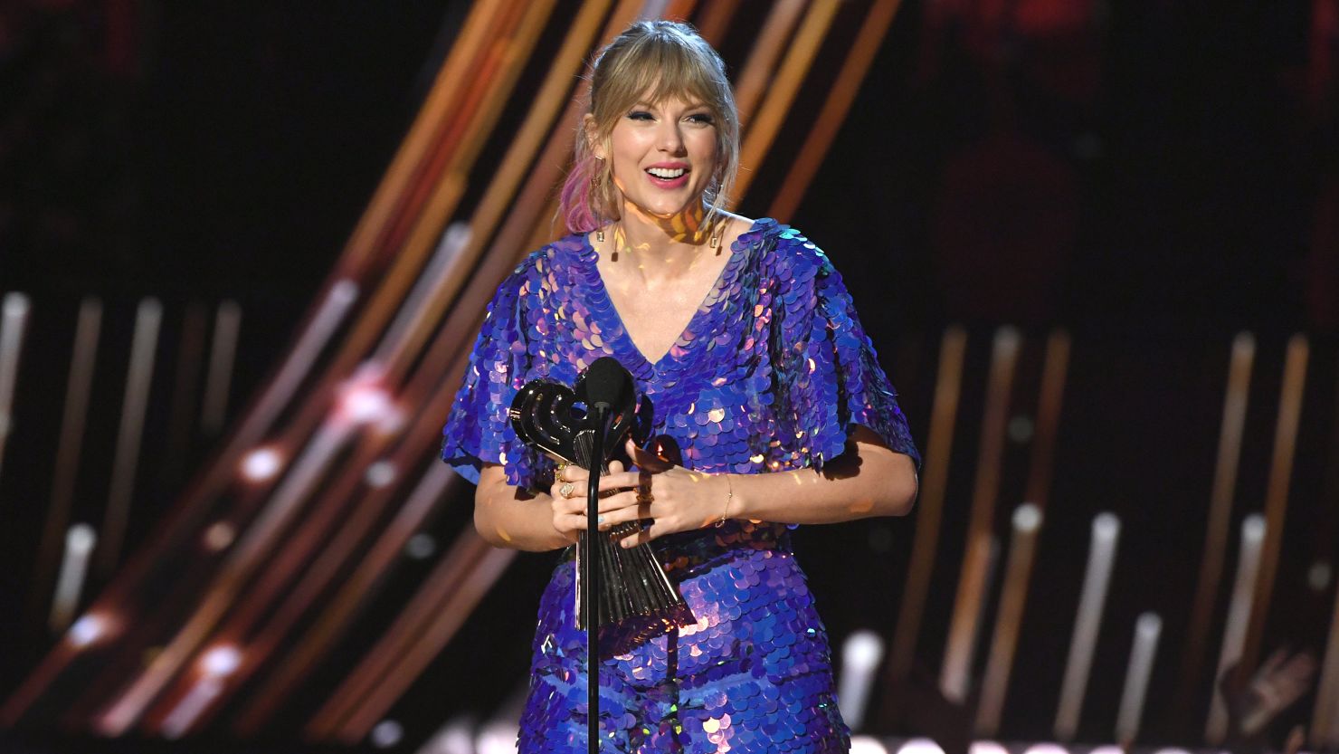 Taylor Swift accepts Tour of the Year honors Thursday at the iHeartRadio Music Awards in Los Angeles.