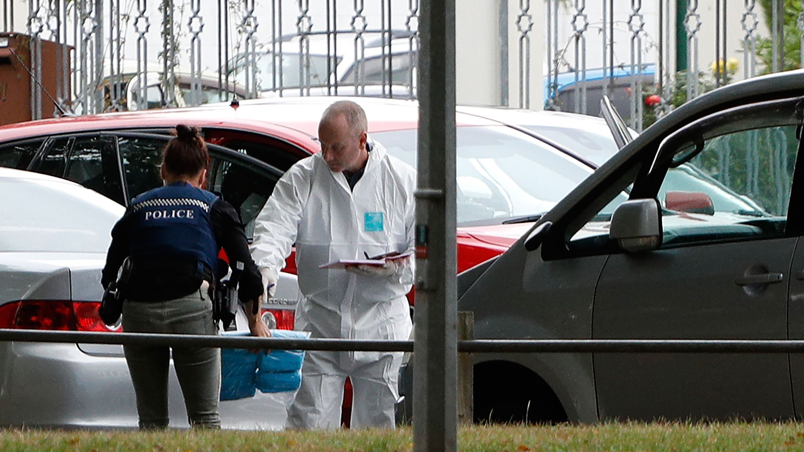 A forensics official works at the al Noor mosque after the attack.