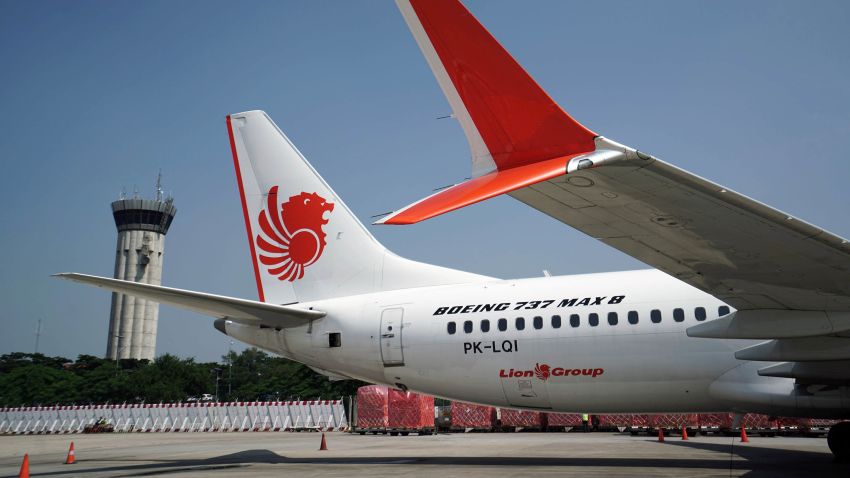 A grounded Lion Air Boeing Co. 737 Max 8 aircraft sits on the tarmac at terminal 1 of Soekarno-Hatta International Airport in Cenkareng, Indonesia, on Tuesday, March 15, 2019. Sundays loss of an Ethiopian Airlines Boeing 737, in which 157 people died, bore similarities to the Oct. 29 crash of another Boeing 737 Max plane, operated by Indonesias Lion Air, stoking concern that a feature meant to make the upgraded Max safer than earlier planes has actually made it harder to fly. Photographer: Dimas Ardian/Bloomberg via Getty Images
