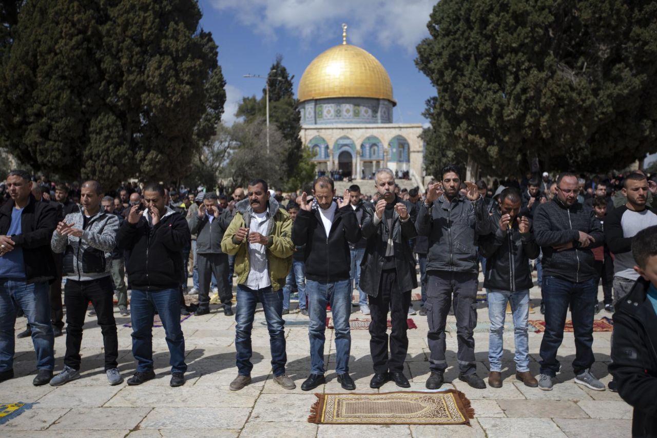 People pray for the victims at the al-Aqsa Mosque on Friday, March 15, in Jerusalem.