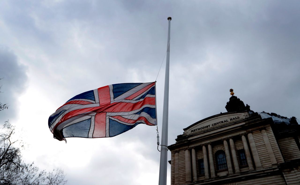 A flag flies at half-staff in London on March 15.