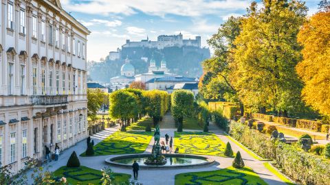 Beautiful view of famous Mirabell Gardens with the old historic Fortress Hohensalzburg in the background in Salzburg, Austria 