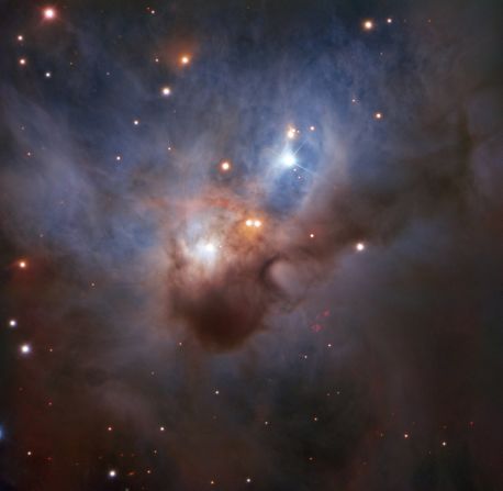 Hidden in one of the darkest corners of the Orion constellation, this Cosmic Bat is spreading its hazy wings through interstellar space two thousand light-years away. It is illuminated by the young stars nestled in its core — despite being shrouded by opaque clouds of dust, their bright rays still illuminate the nebula.