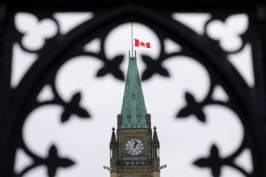 The Canadian flag flies at half-staff on the Peace Tower in Ottawa.