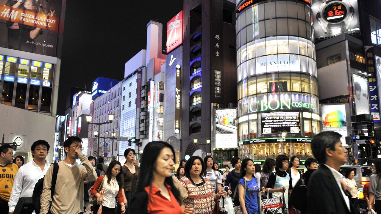 Pedestrians cross an intersection in Tokyo's Ginza district