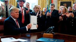 President Donald Trump signs the first veto of his presidency in the Oval Office of the White House, Friday, March 15, 2019, in Washington. Trump issued the first veto, overruling Congress to protect his emergency declaration for border wall funding. (AP Photo/Evan Vucci)