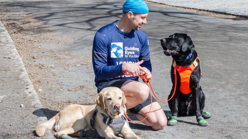 Thomas Panek, President & CEO of Guiding Eyes for the Blind, with his personal guide dog, Gus, and Westley.