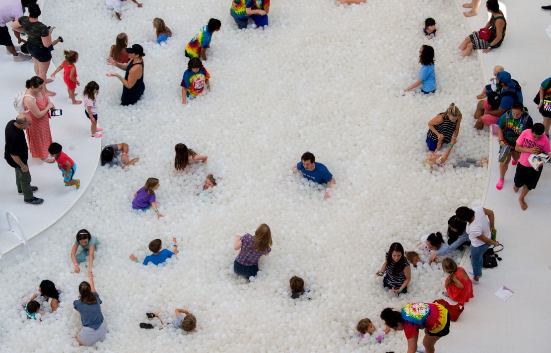 Snarkitecture's traveling installation, "The Beach," transforms indoor spaces into beach resorts with "water" made from over a million plastic balls. 
