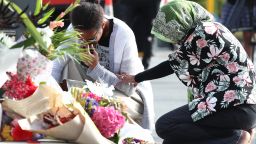 CHRISTCHURCH, NEW ZEALAND - MARCH 16: Locals lay flowers in tribute to those killed and injured at Deans Avenue near the Al Noor Mosque on March 16, 2019 in Christchurch, New Zealand. At least 49 people are confirmed dead, with more than 40 people injured following attacks on two mosques in Christchurch on Friday afternoon. 41 of the victims were killed at Al Noor Mosque on Deans Avenue and seven died at the Linwood Mosque. Another victim died later in Christchurch hospital. Three people are in custody over the mass shootings. One man has been charged with murder.  (Photo by Fiona Goodall/Getty Images)