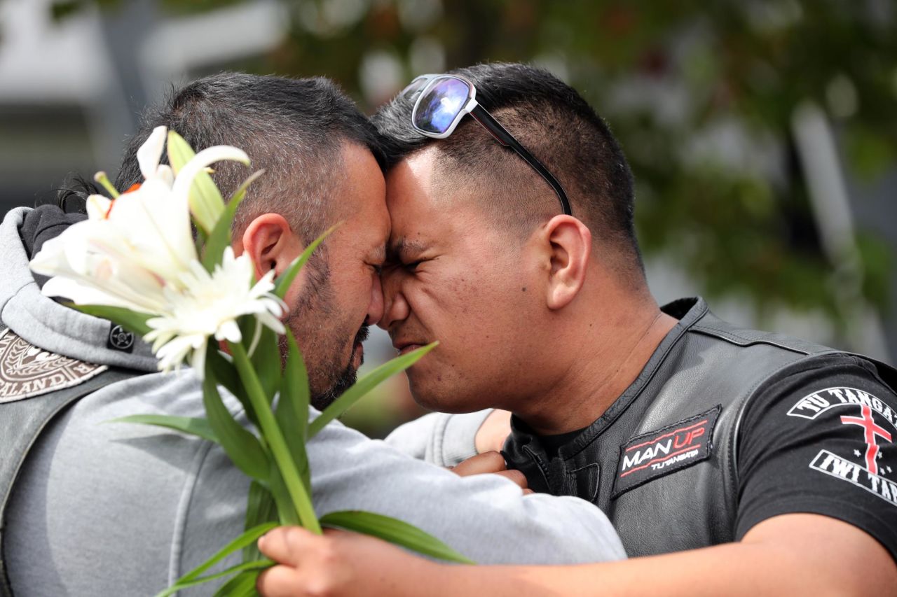 People mourn March 16 at Hagley College in Christchurch.