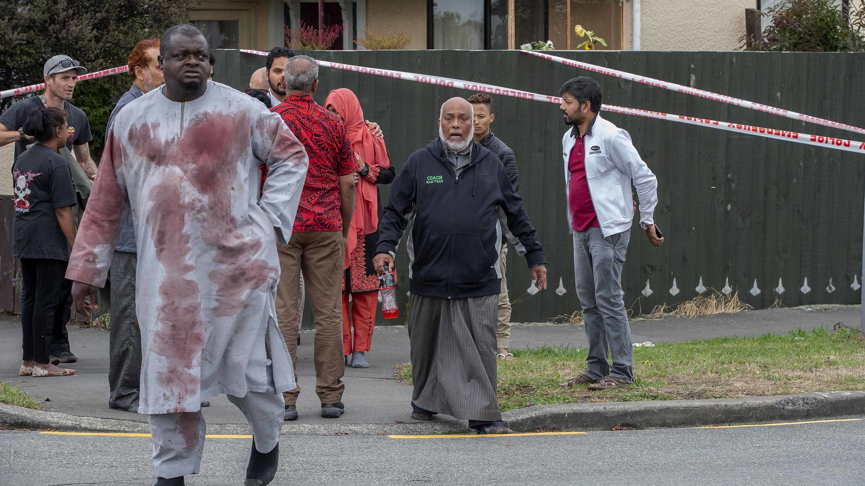 A man with blood-stained clothing is seen near the Linwood mosque on Friday, March 15.