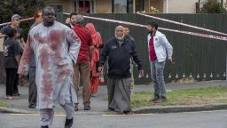 Linwood Ave Christchurch. PHOTO Survivor with blood stained clothes from the shooting comes through the cordon. Christchurch shooting. 