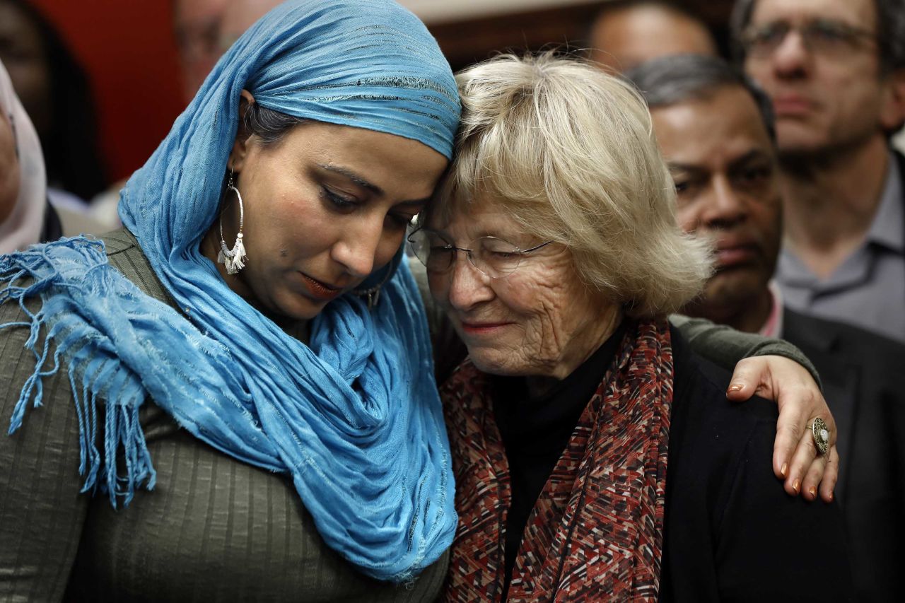 Najeeba Syeed, left, hugs Judy Gilliland at the Islamic Center of Southern California in Los Angeles, where people of all faiths came together in prayer March 16.