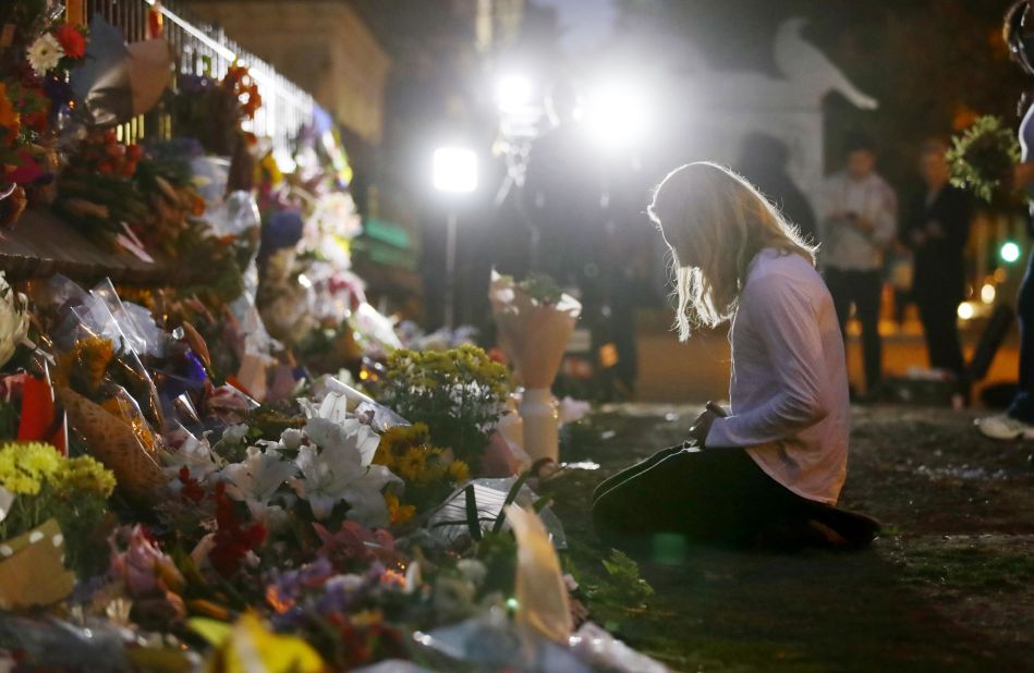 A woman visits a makeshift memorial in Christchurch.